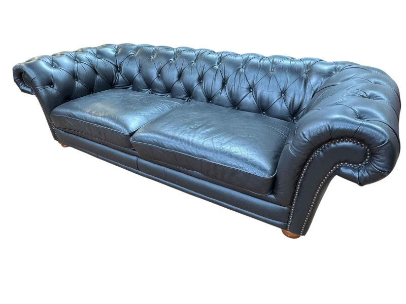 Black buttoned leather and studded three seater Chesterfield settee, 67cm by 238cm by 101cm.