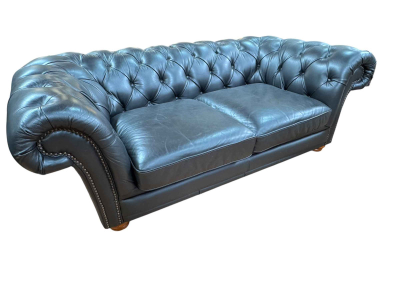 Black buttoned leather and studded two seater Chesterfield settee, 67cm by 201cm by 101cm.