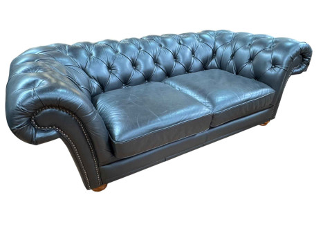 Black buttoned leather and studded two seater Chesterfield settee, 67cm...
