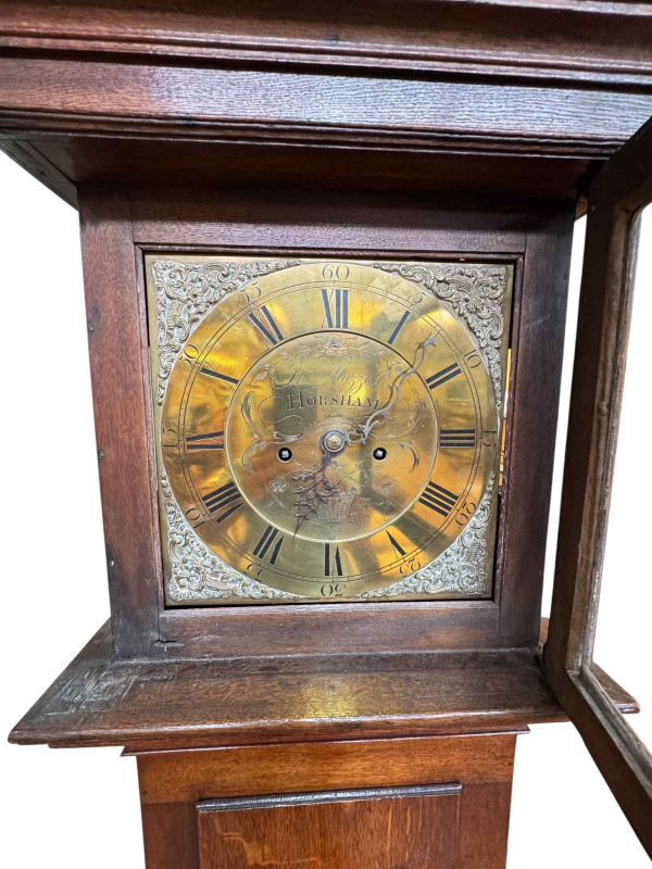 Antique oak eight day longcase clock having square brass dial, signed John Muzzell, Horsham, 214cm.