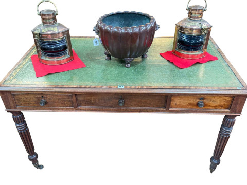 Regency mahogany six drawer library table raised on turned fluted legs...