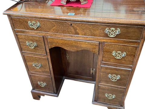 Georgian style mahogany eight drawer kneehole desk having lower inset...