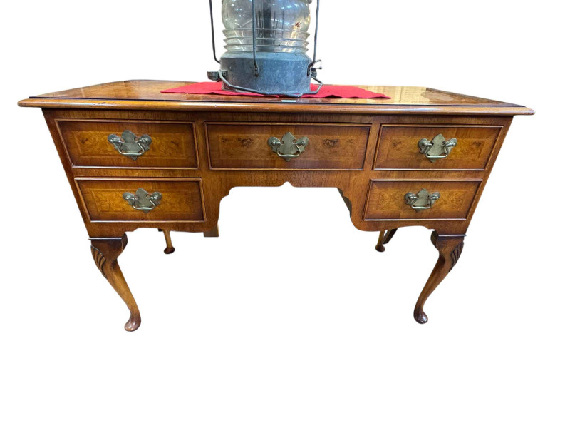 Burr walnut crossbanded five drawer desk on cabriole legs, 75cm by 111cm by 52cm.