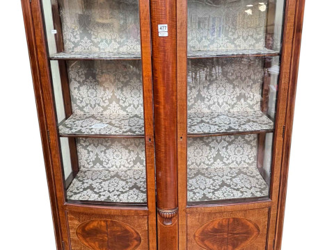 Edwardian mahogany shaped bow front two door vitrine having undershelf...