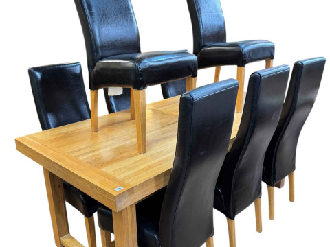 Contemporary light oak eleven piece dining suite comprising three door...