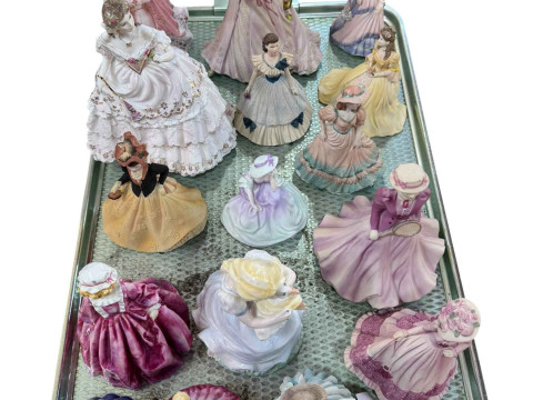 Seventeen Coalport lady figures.