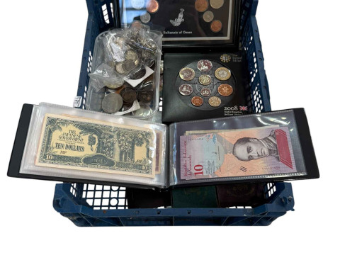 Collection of coinage including silver and World Bank notes.