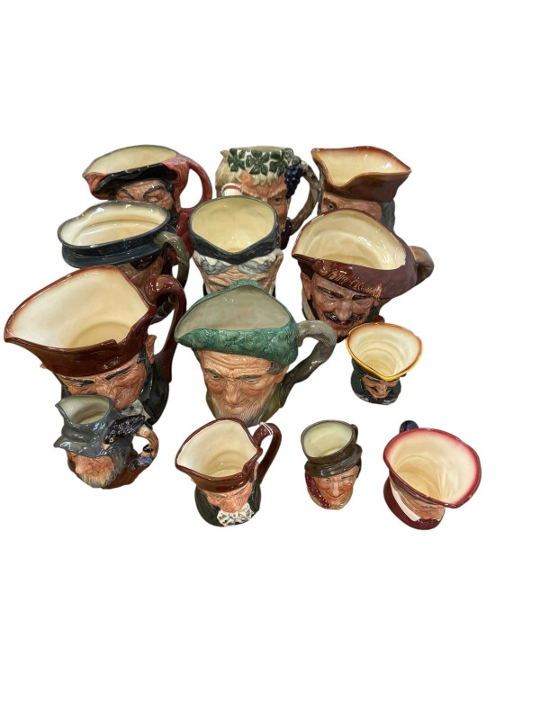 Collection of toby jugs including Royal Doulton Bacchus, Falstaff, Granny, etc.