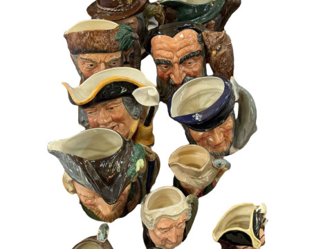 Collection of toby jugs including Royal Doulton Robinson Crusoe, Merlin,...
