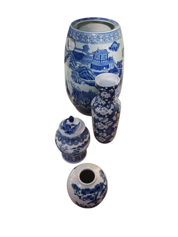 Collection of Oriental blue and white pottery including crackle bowl, vase, lidded jar and a handled vase.