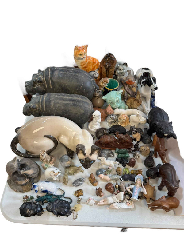 Collection of animal figures including Parian cat, Russian Orangutan, Wade, agate, etc.