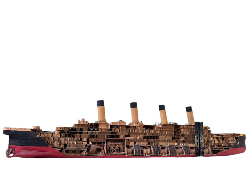 Large model of the Titanic showing structure and a fishing trawler boat 'Carrie Ann'.