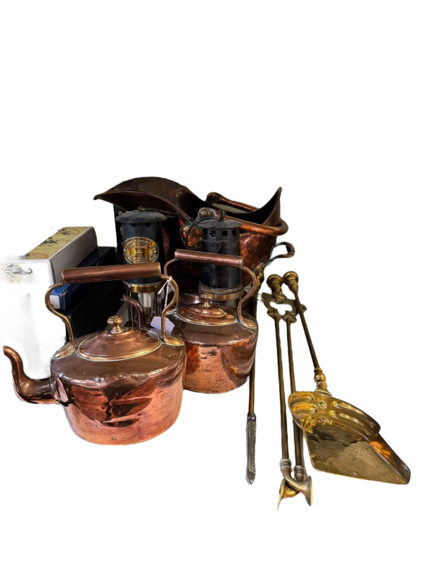 Polished copper handled coal scuttle and two kettles, two miners lamps and brass fire irons.