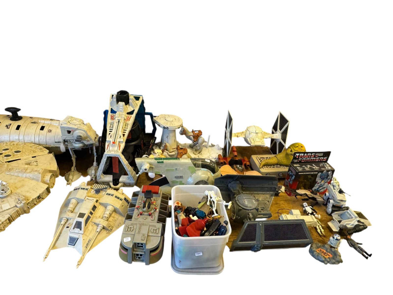 Collection of Star Wars toys and figures.