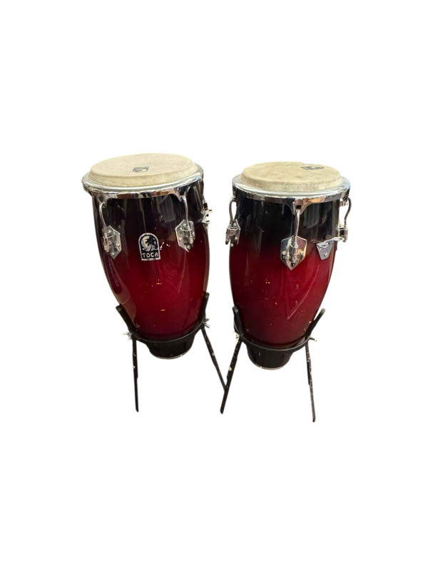 Pair of Tumba drums, flute and clarinet in cases and a Fender amp.