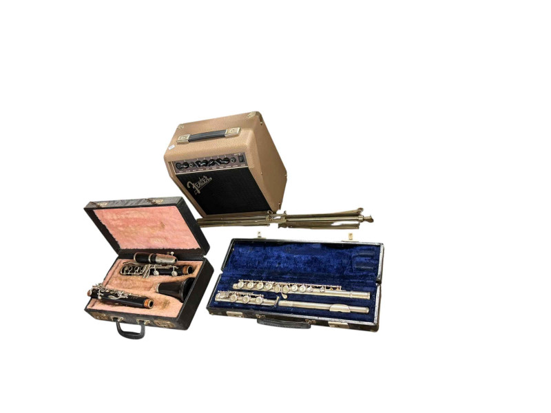 Pair of Tumba drums, flute and clarinet in cases and a Fender amp.
