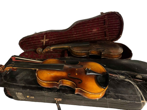 Two guitars and a collection of violins, etc.