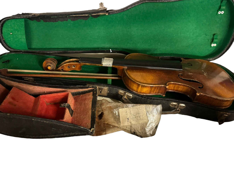 Two guitars and a collection of violins, etc.
