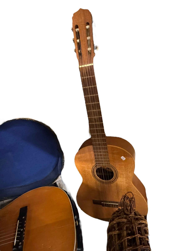Two guitars and a collection of violins, etc.