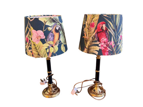 Pair of table lamps with decorative parrot shades.
