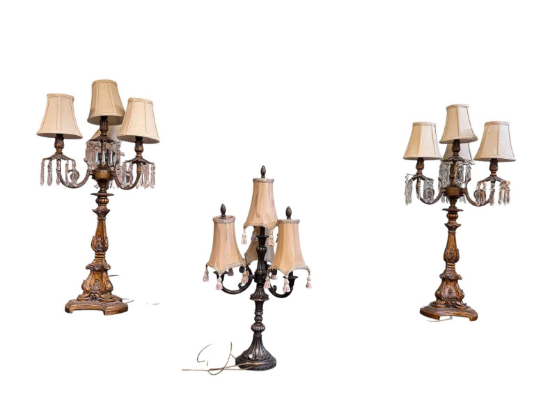 Pair of table lamps with lustres and one loose lamp with shades.
