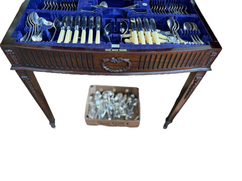 Mahogany Chippendale style table canteen with mixed cutlery.