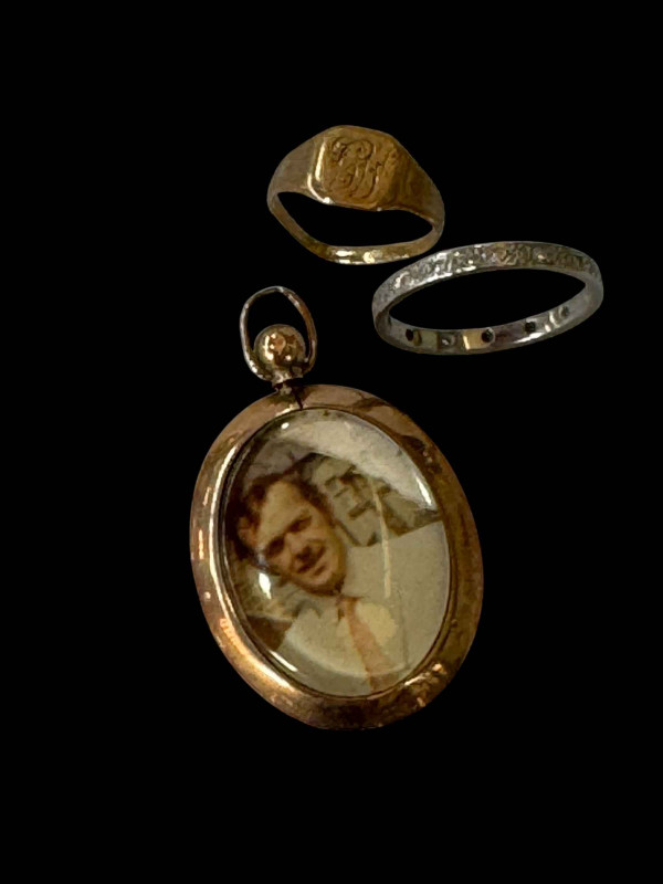 Platinum eternity ring, 9 carat gold signet ring and 9 carat gold photo locket (3).