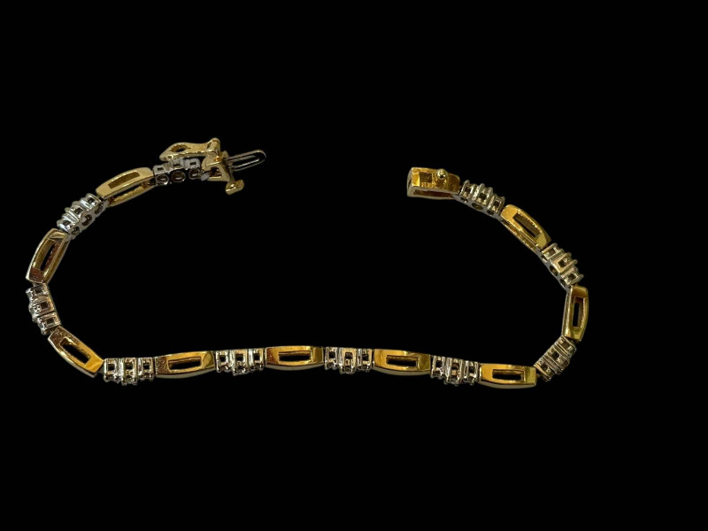 Diamond set 14k two colour gold bracelet, having 30 brilliants.