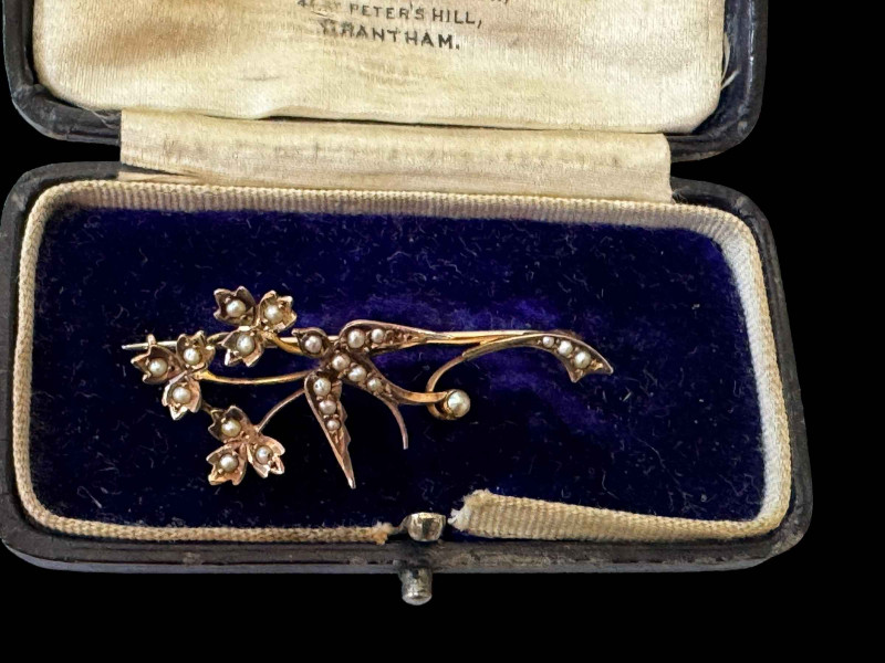 9 carat gold seed pearl bird in branch brooch, 4cm across.