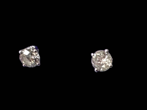 Diamond stud 18 carat gold earrings, total in excess of 1 carat.