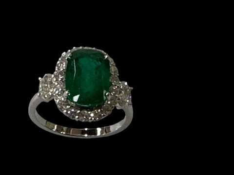 Impressive emerald and diamond cluster 18 carat white gold ring, the cushion...