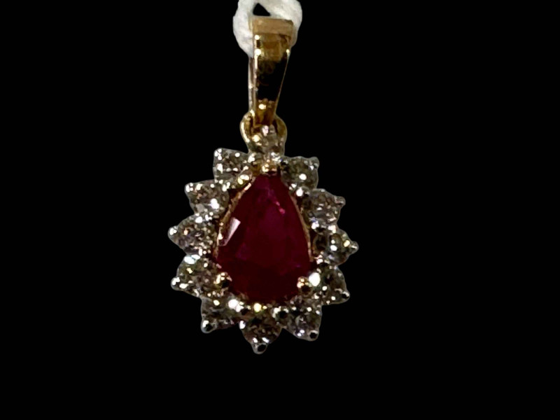 Ruby and diamond cluster 18 carat gold pendant.
