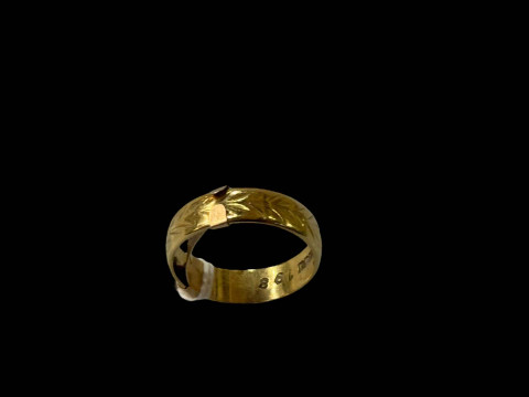 18 carat gold wedding band with 9 carat sizer.