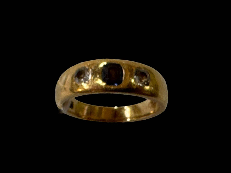 18 carat gold gypsy set sapphire and diamond ring, size P.
