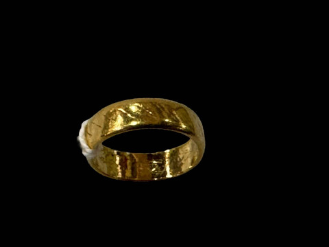 Gold wedding band, unmarked.