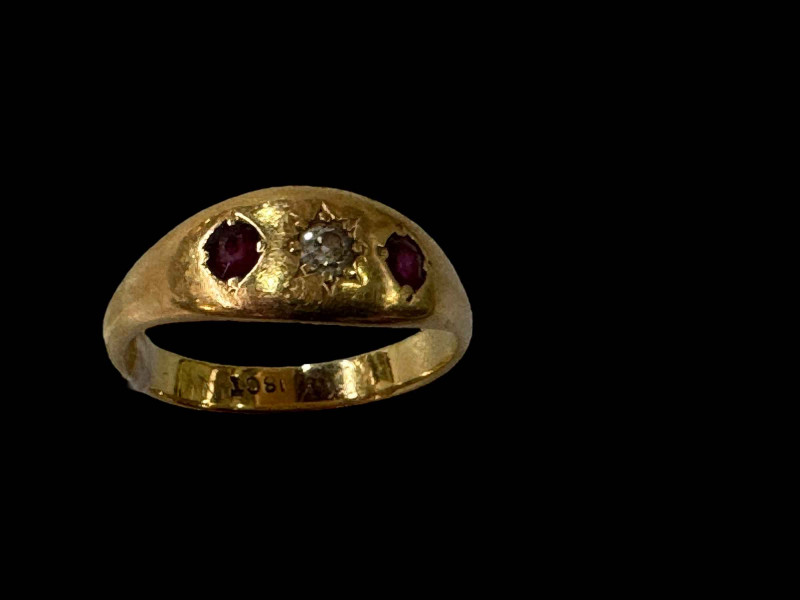 18 carat gold gypsy setting diamond and ruby ring.
