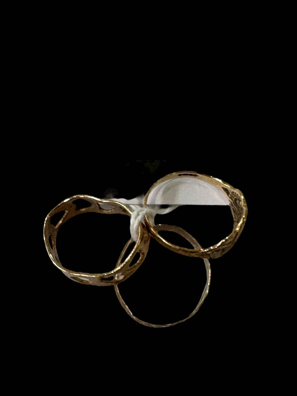 Three 9 carat gold rings.