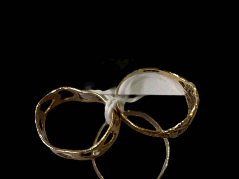 Three 9 carat gold rings.