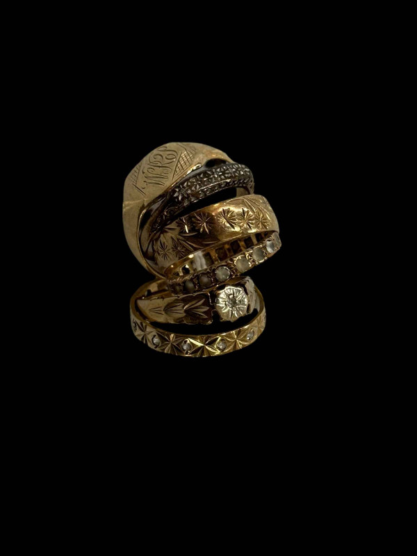 Six 9 carat gold rings, three gem set.