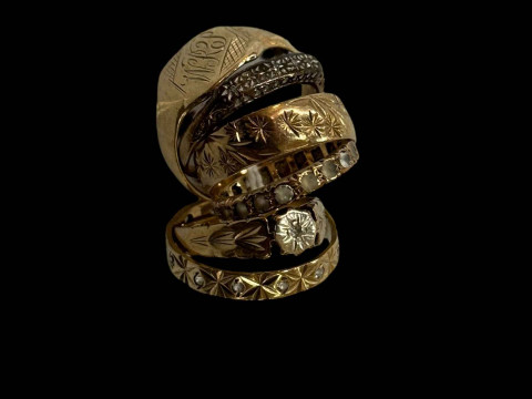 Six 9 carat gold rings, three gem set.