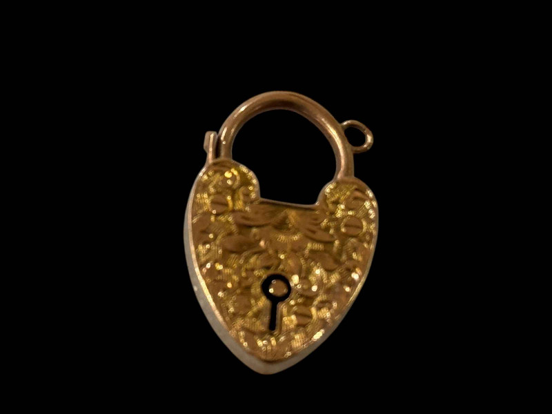 9 carat gold engraved padlock fastener.