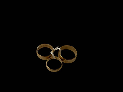 Three 9 carat gold band rings.