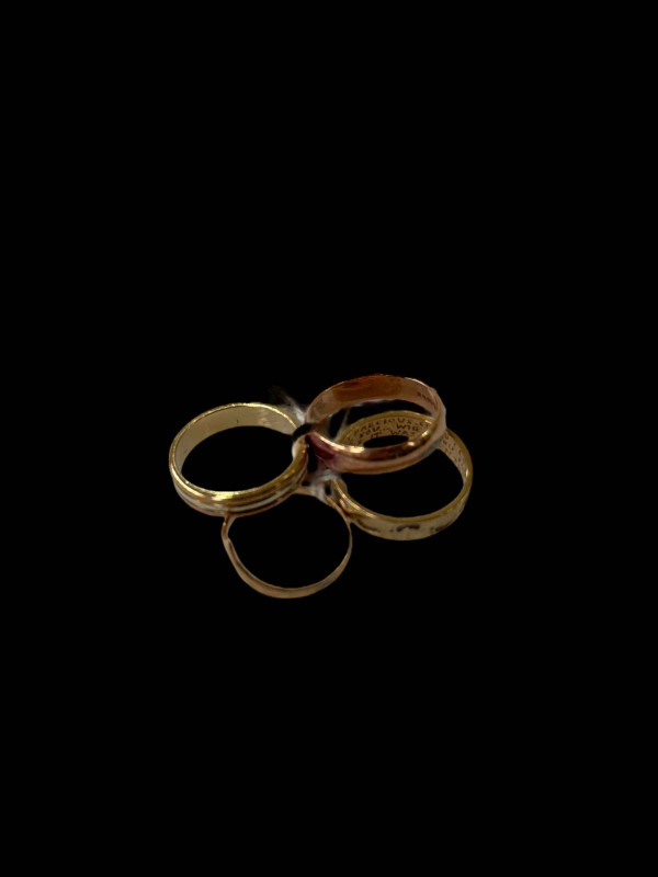 Four 9 carat gold rings.