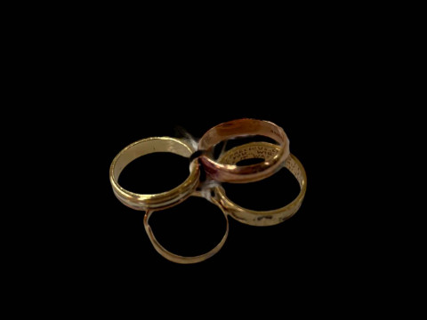 Four 9 carat gold rings.