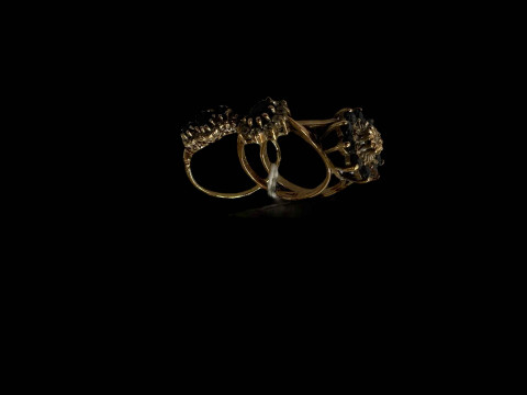 Three 9 carat gold gem set cluster rings.