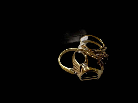 Four rings including two 9 carat gold hallmarked.