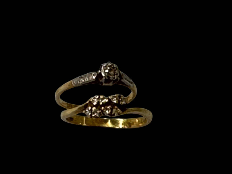 Two 18 carat gold diamond set rings.