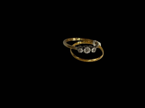 22 carat gold band ring and 9 carat gold and platinum three stone ring...