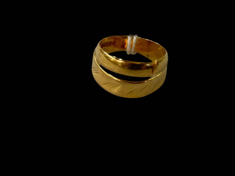 Two 22 carat gold band rings, one cut.