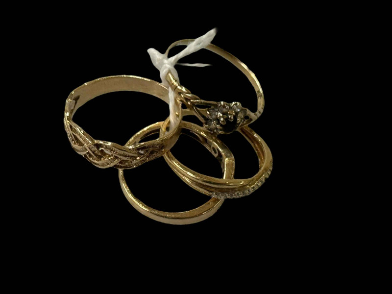 Four 9 carat gold rings, three gem set.